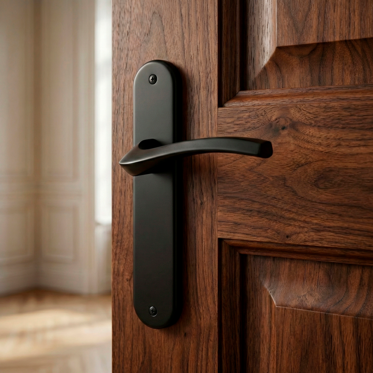Manilla modelo '1027' con placa ovalada negra de zamak para puertas