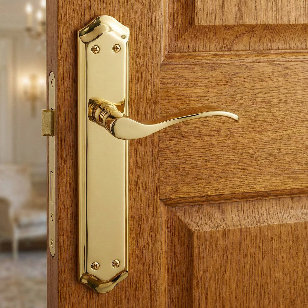 Manilla modelo '881' con placa ovalada de aluminio en acabado dorado satinado para puertas
