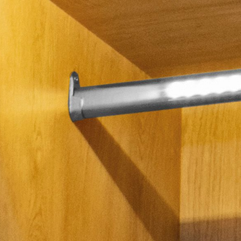 Soporte lateral niquelado para tubos de 30x15x45mm ovalados de armario