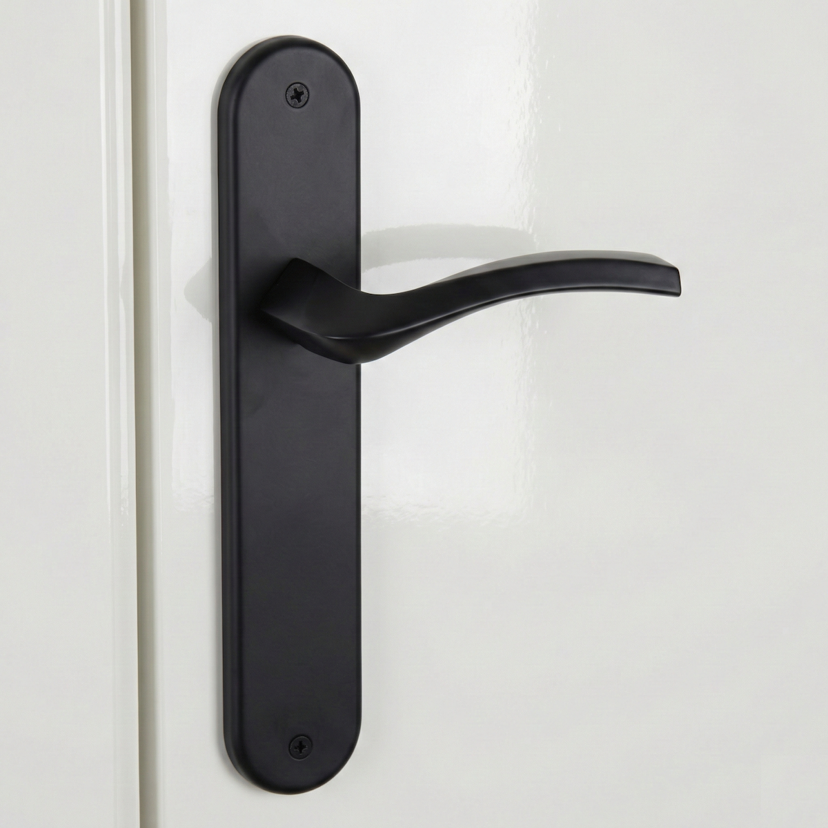 Manilla modelo '1027' con placa ovalada negra de zamak para puertas