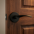 Manilla con roseta redonda tapa-pomos negro para puertas modelo 'ARI130'