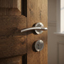 Manilla de aluminio Belenus con Roseta Redonda en acabado níquel combinado para puertas