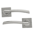 Juego de manillas de zamak en acabado bicolor y roseta cuadrada para puertas