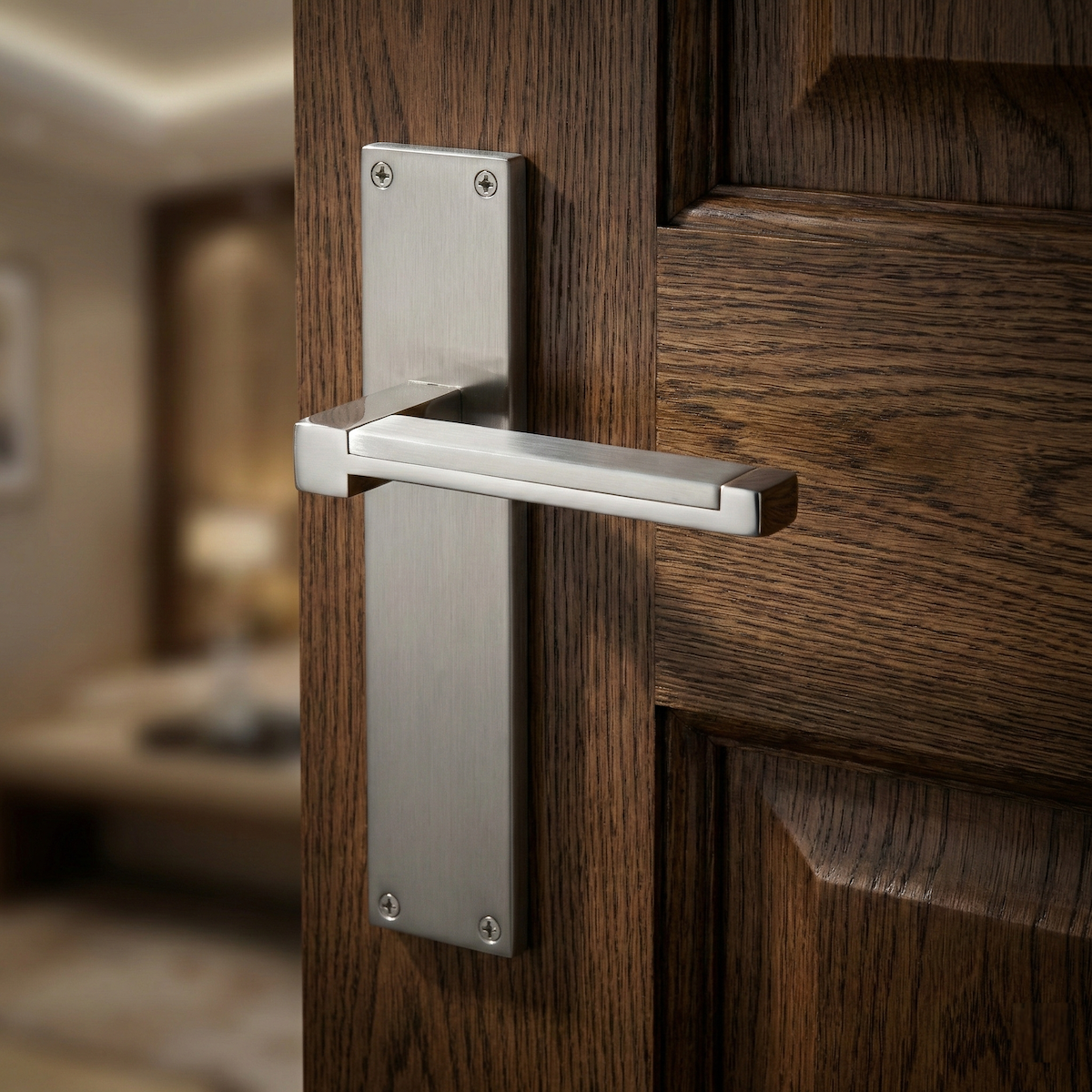Manilla modelo 610 con placa rectangular de zamak acabado níquel satinado para puertas