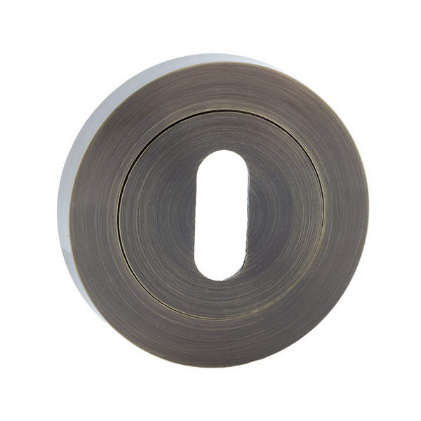 Bocallave roseta redonda oval en acabado cuero para puertas