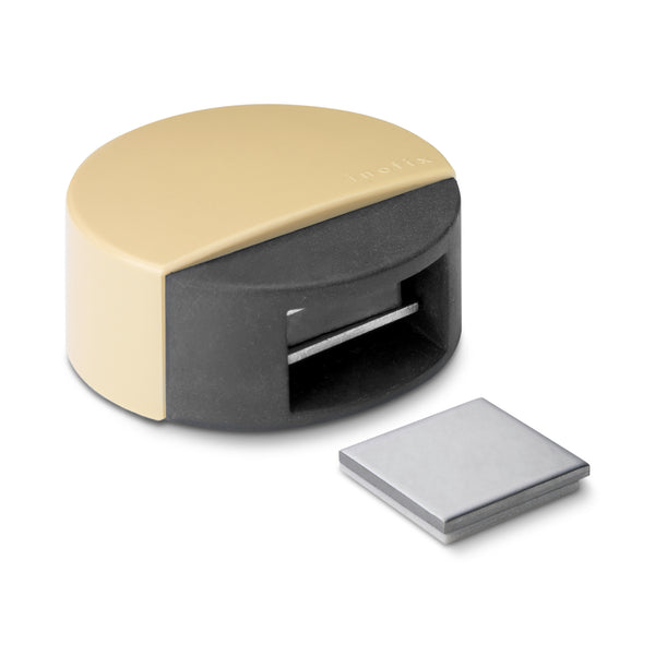 Self-adhesive door stopper in beige finish with magnetic retainer function