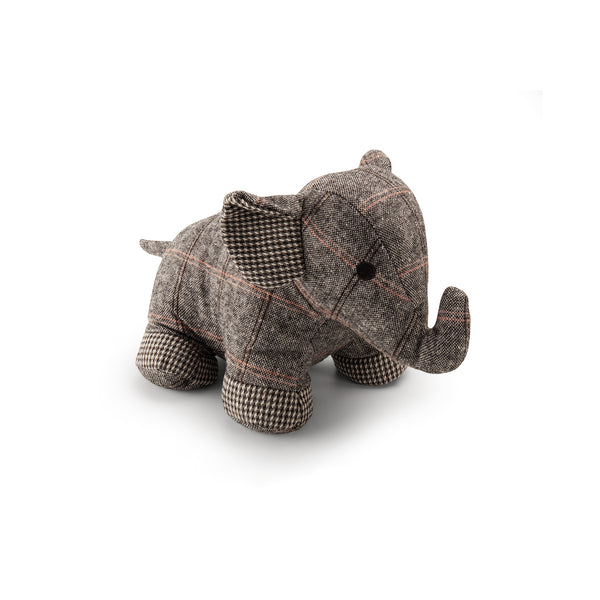 Decorative textile elephant-shaped retainer for doors filled with sand and cotton