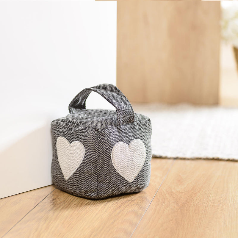 Gray cube-shaped textile door retainer stopper with heart