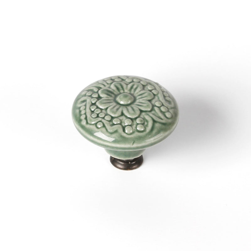 Pomo decorativo ovalado de porcelana y zamak acabado verde de 44mm de diámetro para muebles