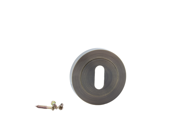 Bocallave roseta redonda oval en acabado cuero para puertas